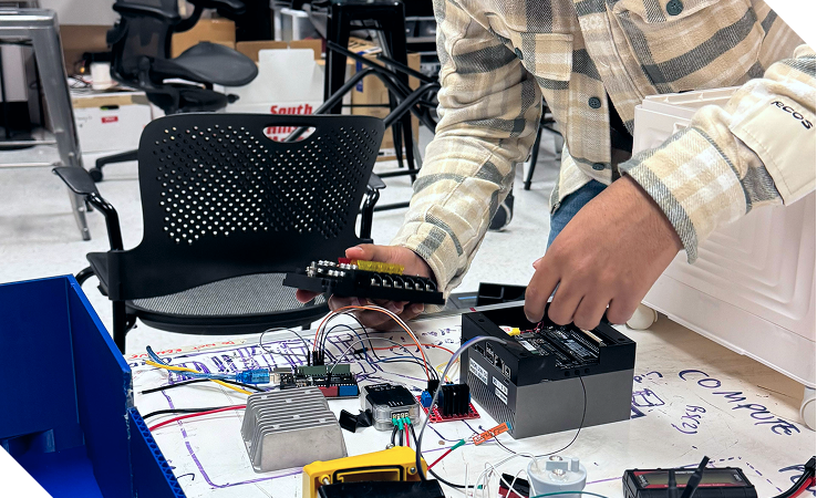 Team member working on electronics